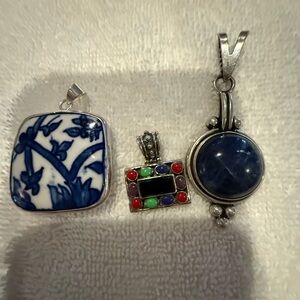 Set of 3 silver and stone pendants.